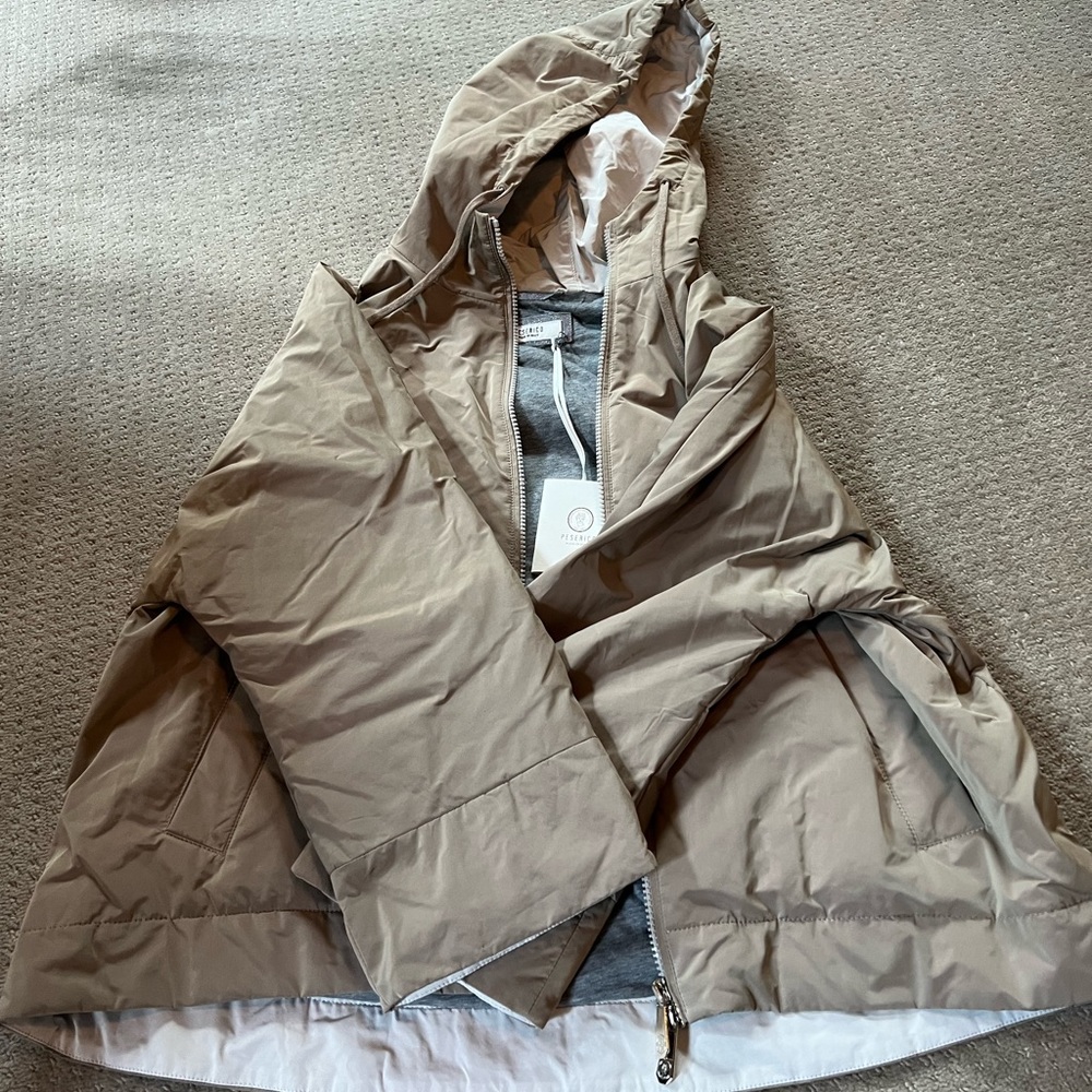 A tan bomber jacket with hood